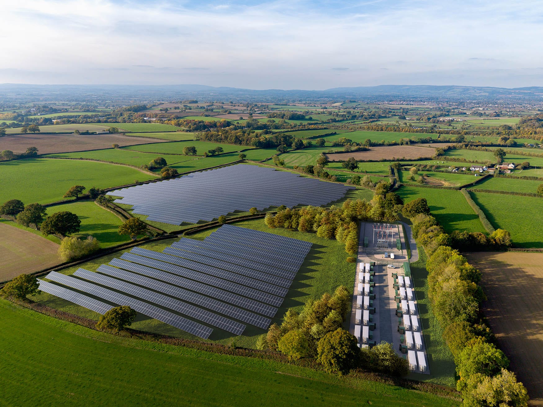 An aerial drone photograph of a British countryside with proposed BESS and solar 3d rendered and composited in